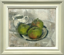 Load image into Gallery viewer, 9.5 x 11.75 inch oil painting of green Bramley apples on a dish with a blue rim and inner, next to a ceramic jug top left of painting. Shows the hand-painted frame, coloured off-white inner edge to greenish/grey outer edge, the painting &#39;floating&#39; with a small space all around.
