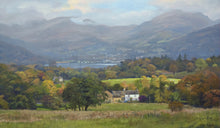 Load image into Gallery viewer, 10 x 17 inch landscape, with the white, sunlit High Wray Farm in the middle distance, with Windermere Lake in the distance and the blue distant mountains partly shrouded under cloud. Lots of Autumn-coloured trees abounding throughout.
