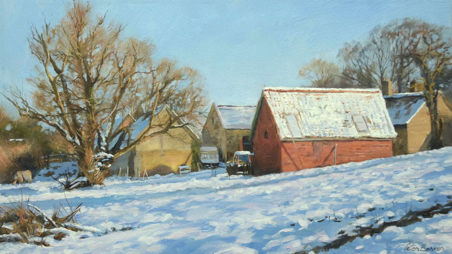 Panoramic-shaped oil painting of barns in the village after a fresh snowfall, with bright blue sky, snow on the ground and several trees, and a brick barn with a snow-topped roof. 